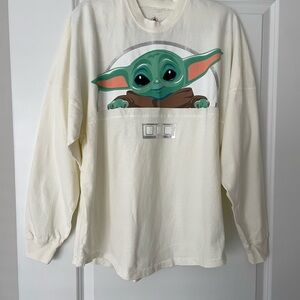 Cream Long Sleeve Tee with Green Character Design